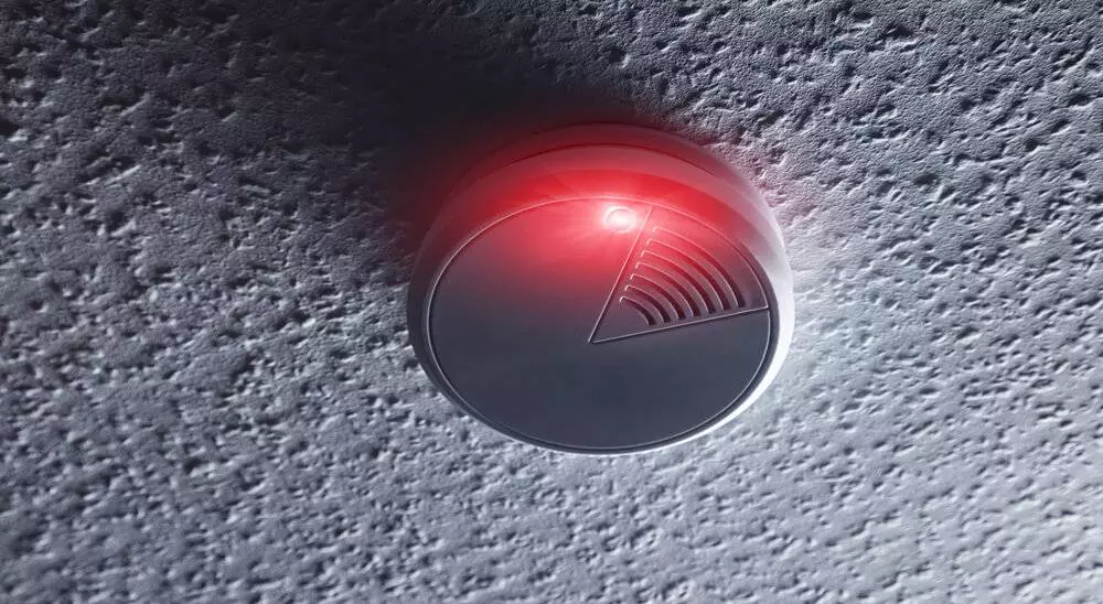 A smoke detector with red light